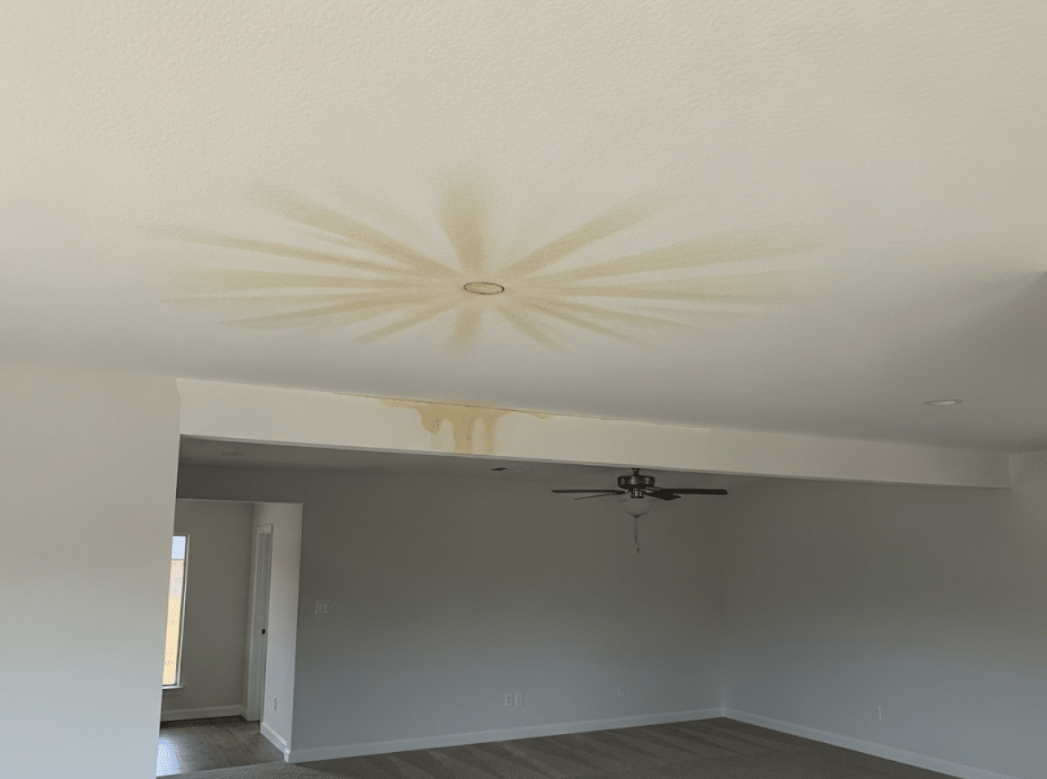 home showing water stains on ceiling from roof leak