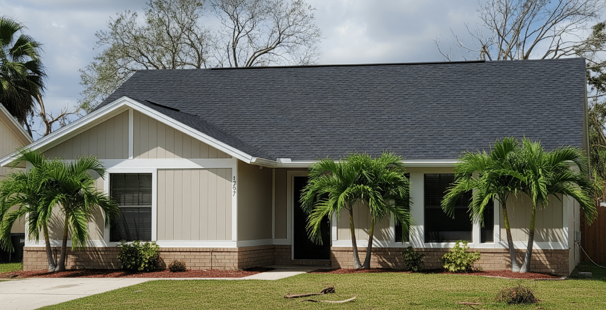 suburban home with a newly installed roof and repaired siding after hurricane recovery