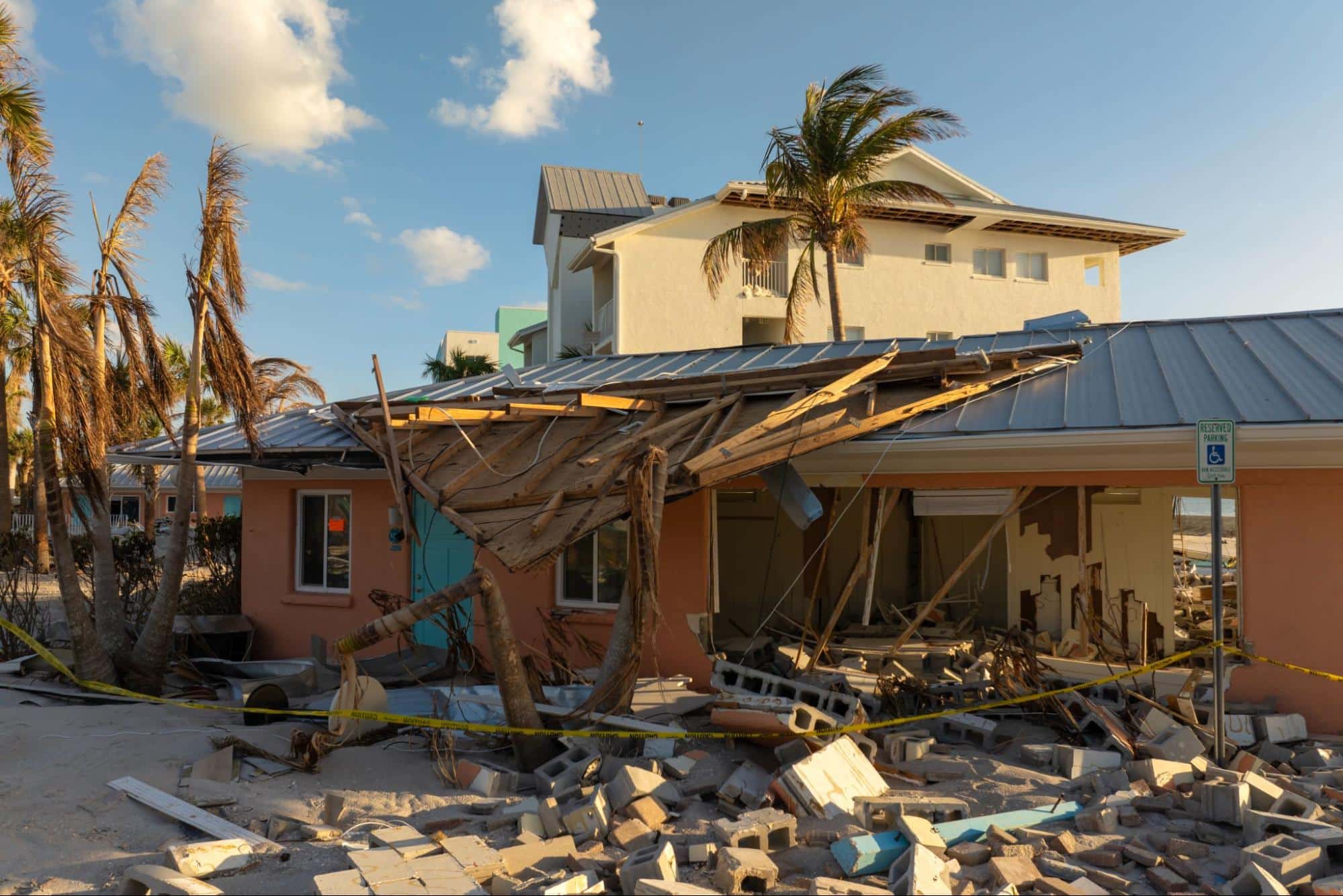 Damaged residential houses on Florida’s shore, showing the need for emergency response services near me