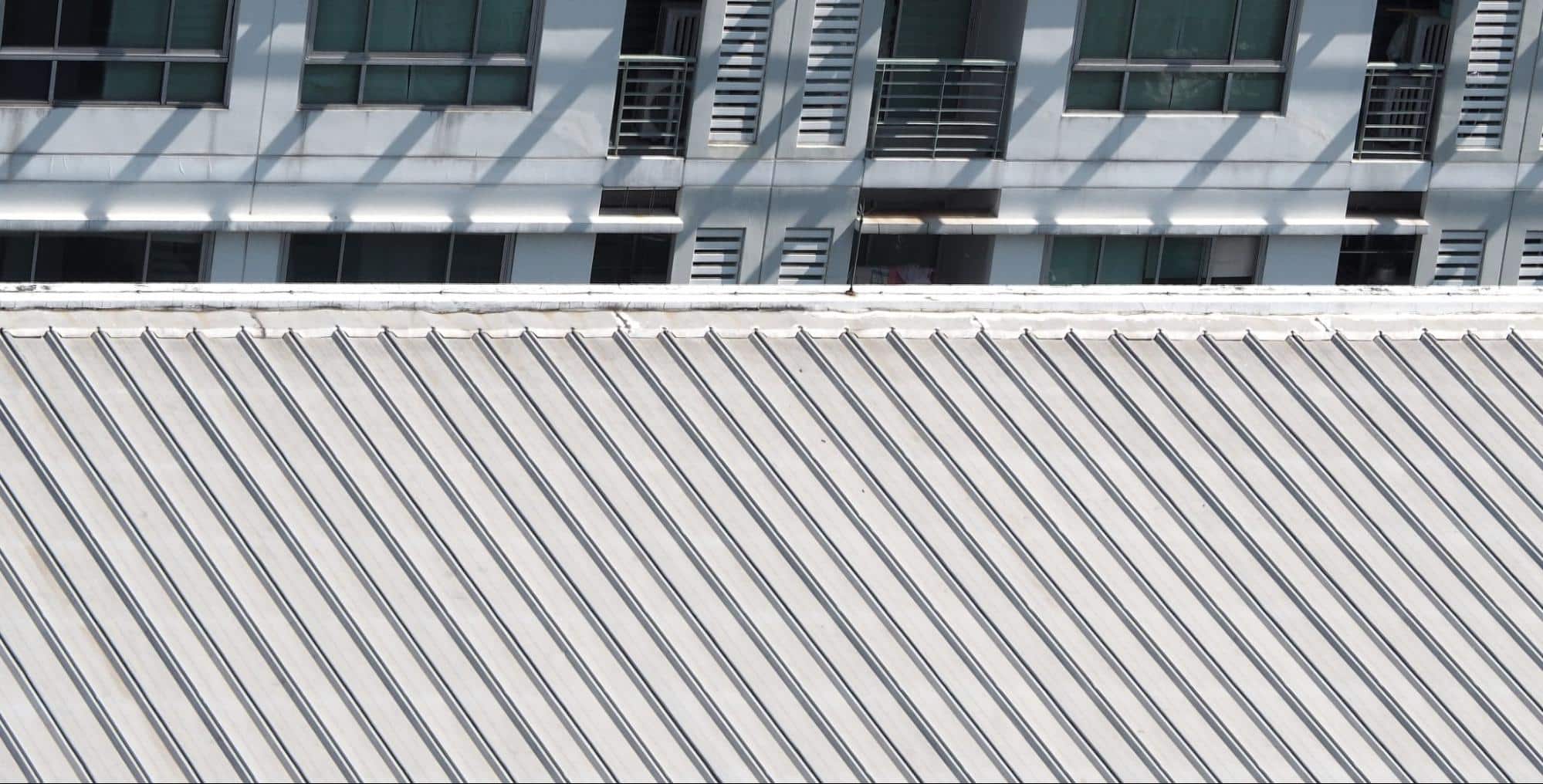 sleek metal roof reflecting sunlight, representing durable and energy-efficient Miami metal roofing designed for coastal resilience