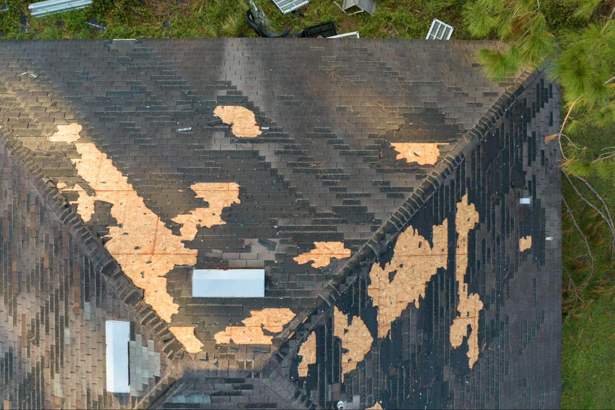 storm-damaged roof, illustrating the signs you need a new roof