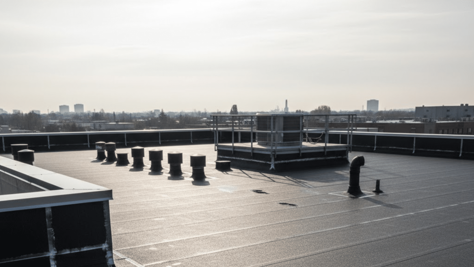 commercial roof with a newly installed modified bitumen (mod-bit) system, emphasizing its durability