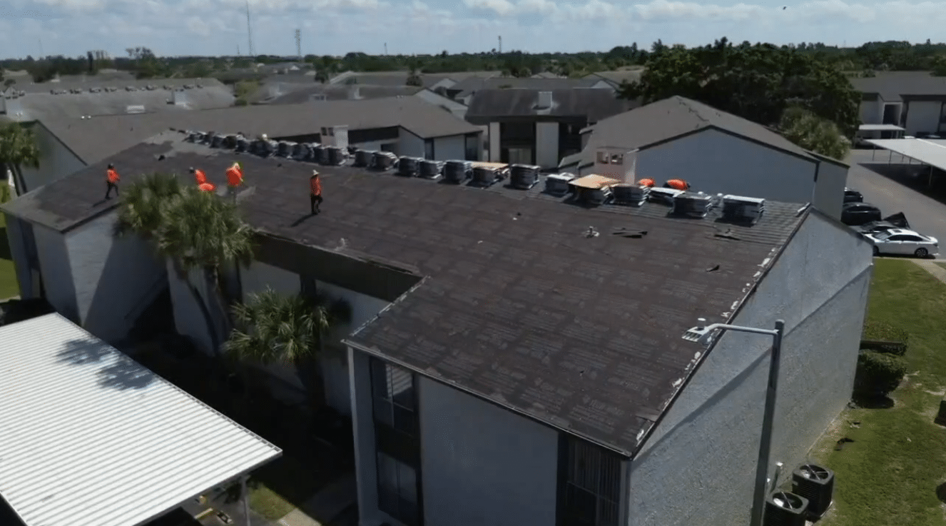 RNC US team at work inspecting a Gulf Coast home roof to help homeowners understand what are the types of roofing materials best suited for coastal climates.