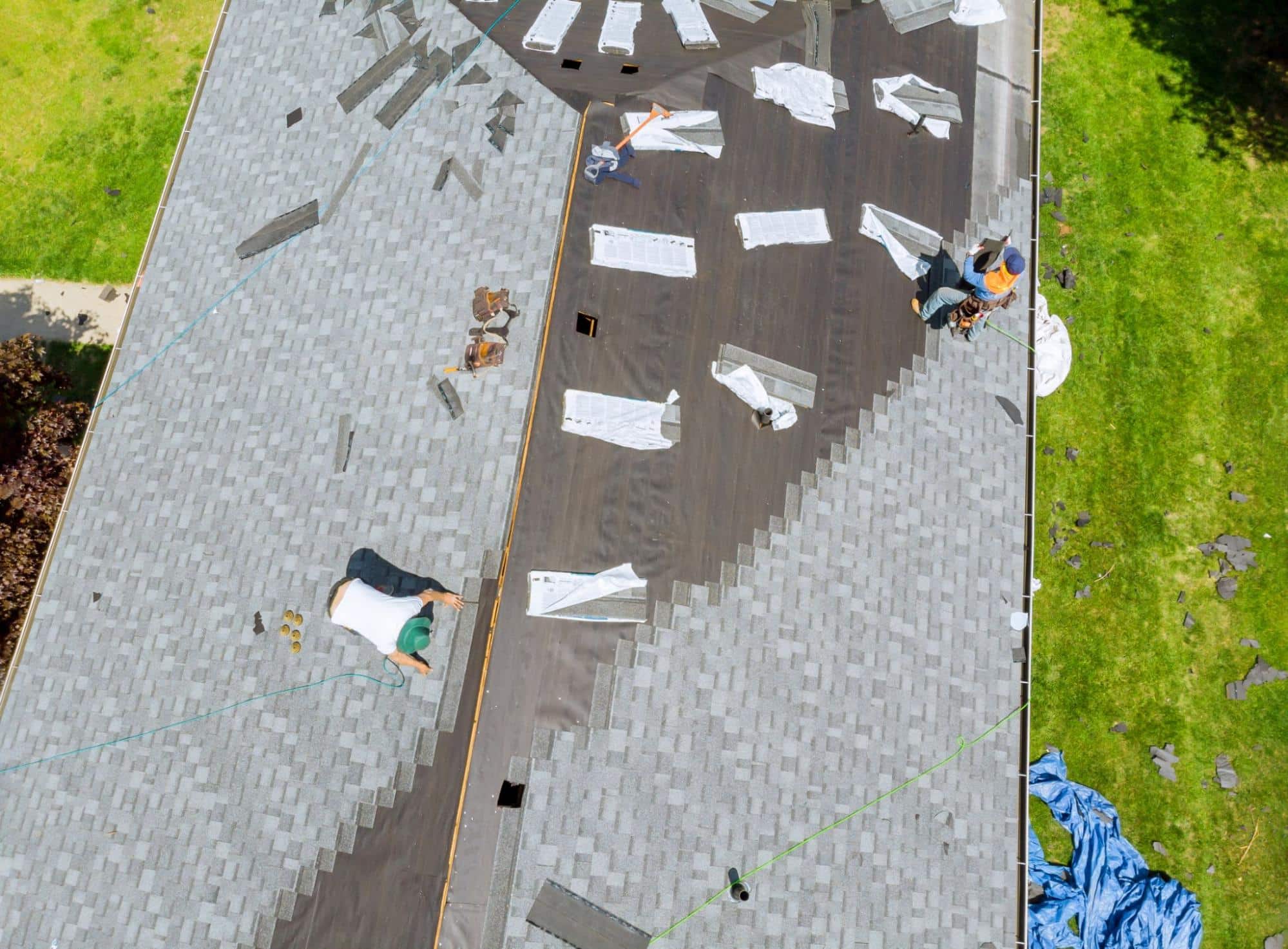roofers working on asphalt shingle roofing