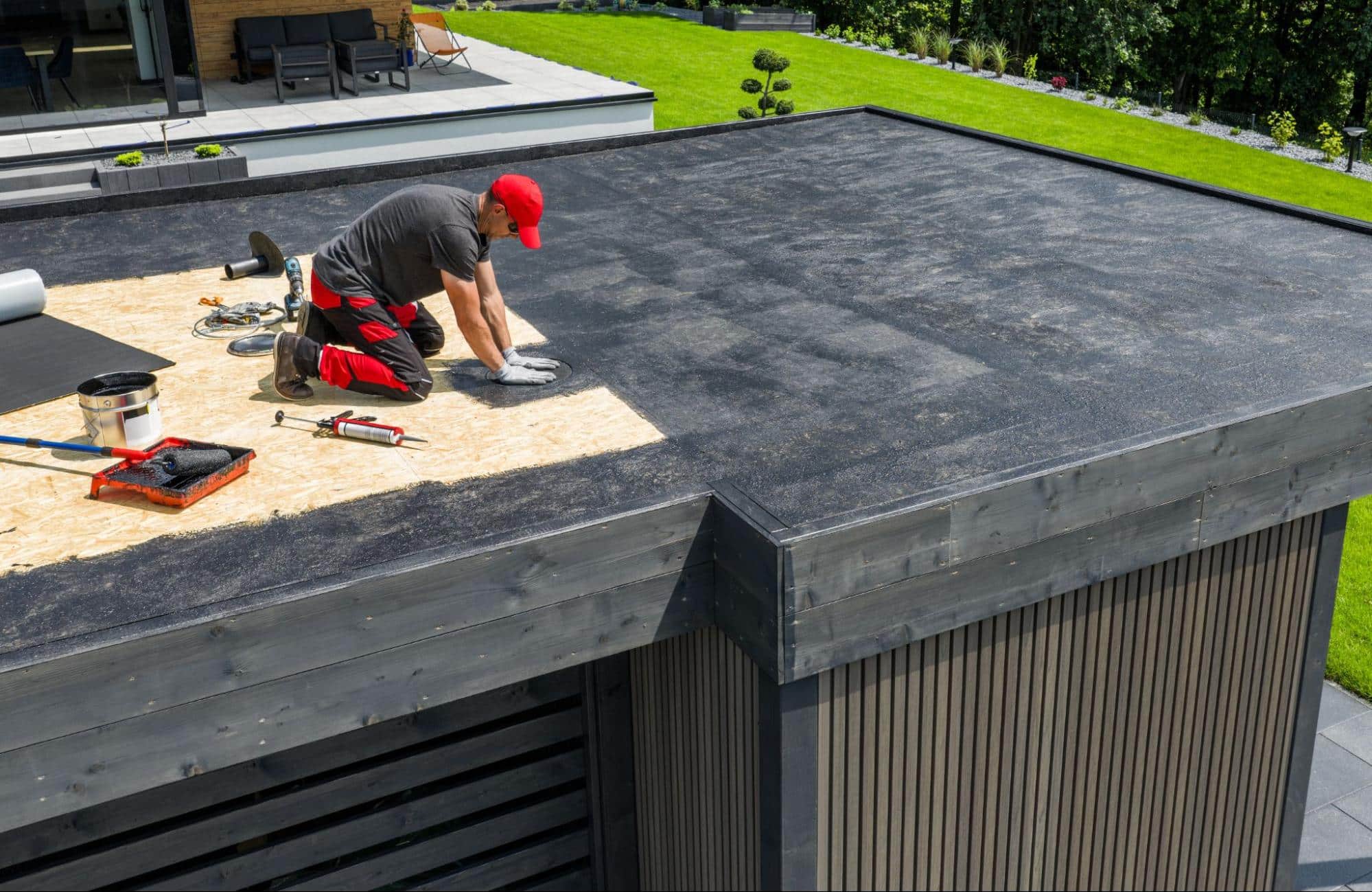man working on a flat roof