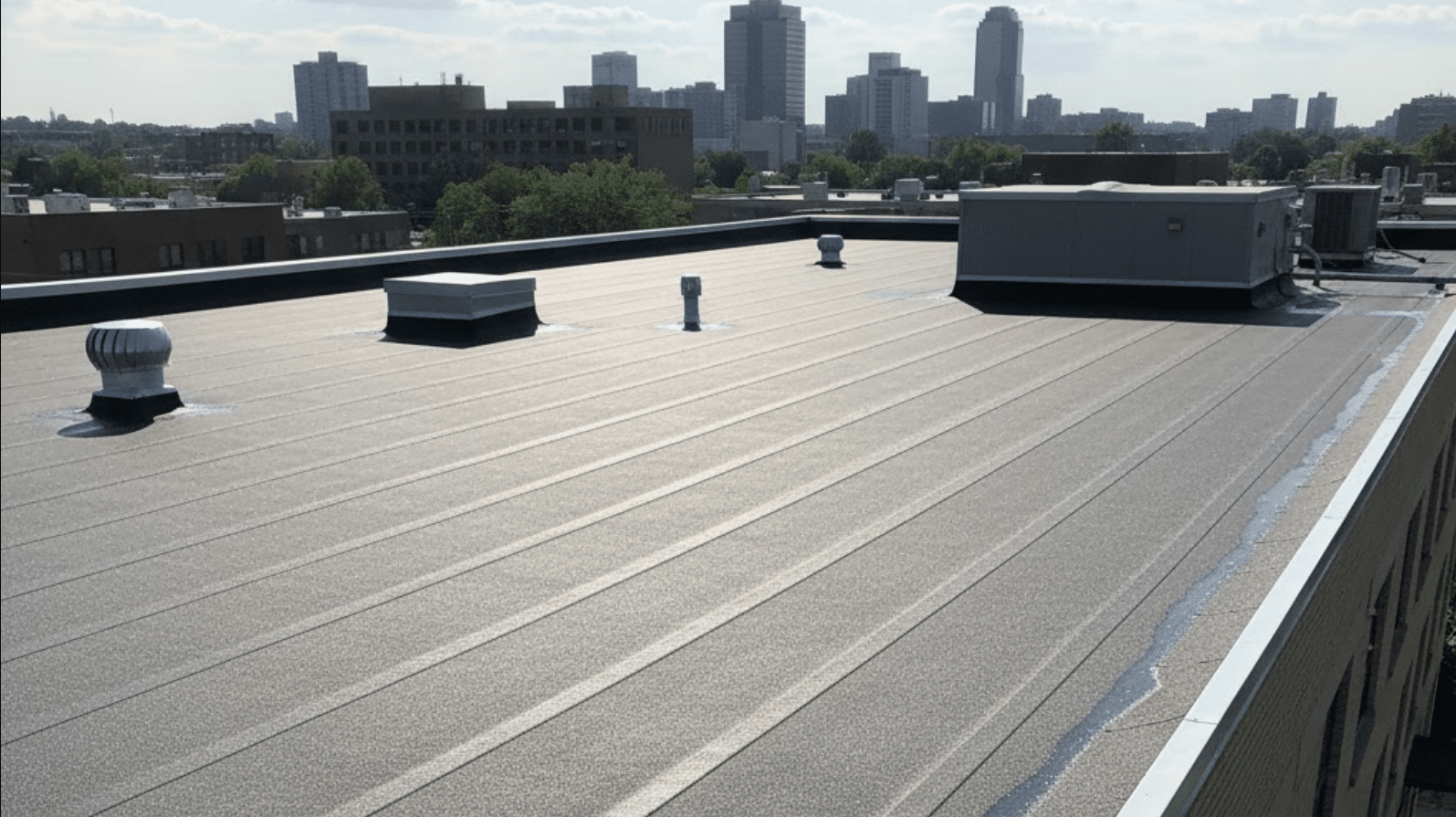 commercial roof with a newly installed modified bitumen (mod-bit) system