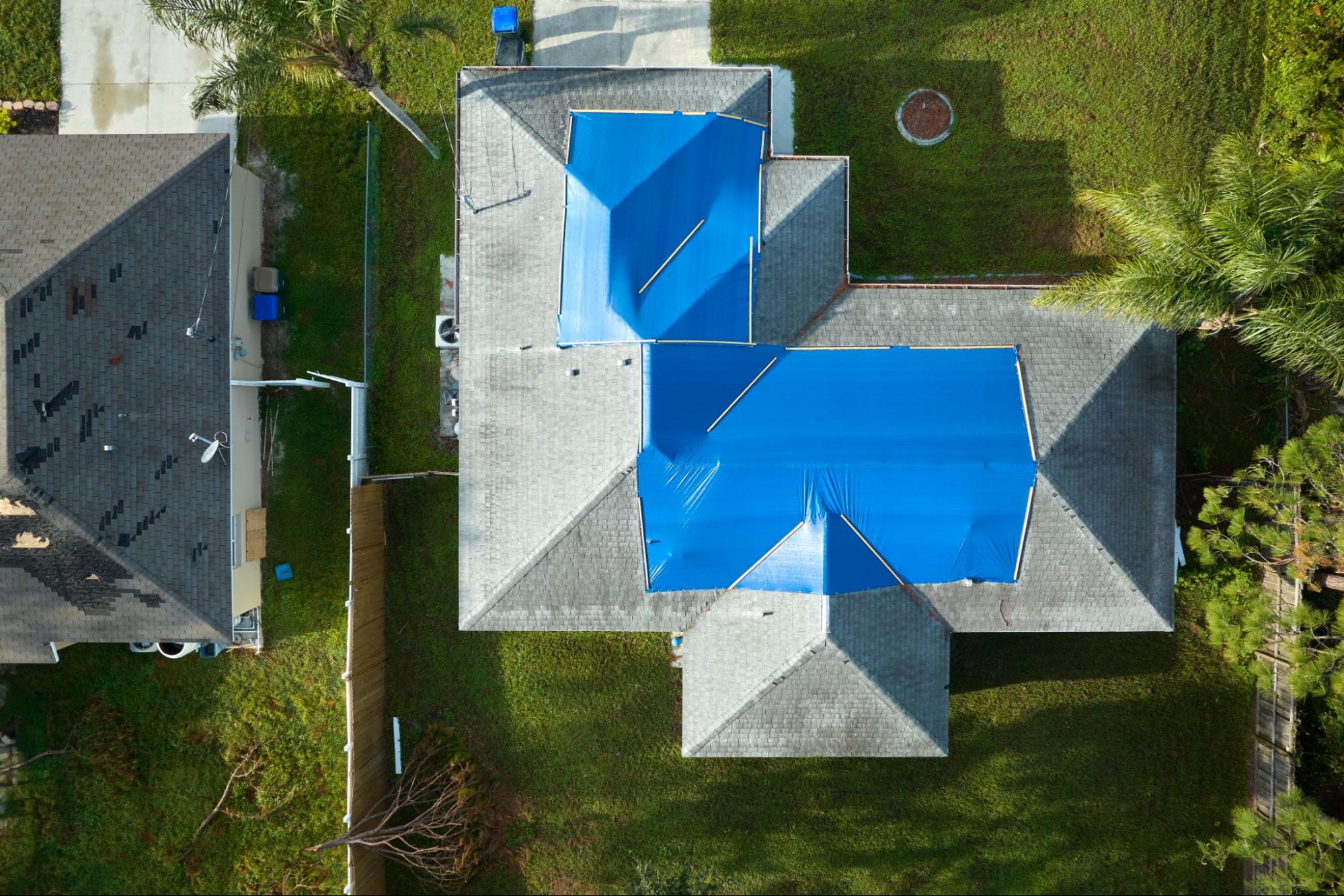 roof with protective tarp