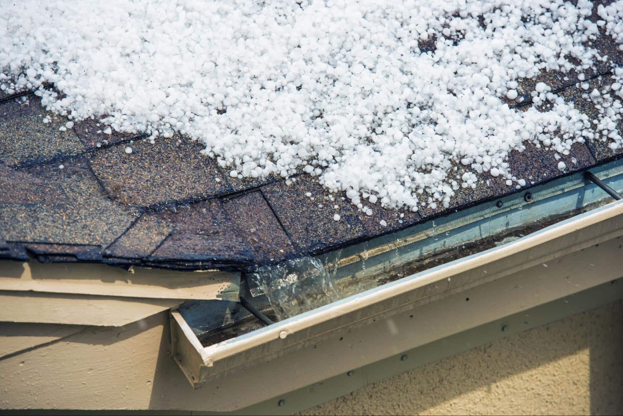 hail on roof, representing the need for top roofing solutions